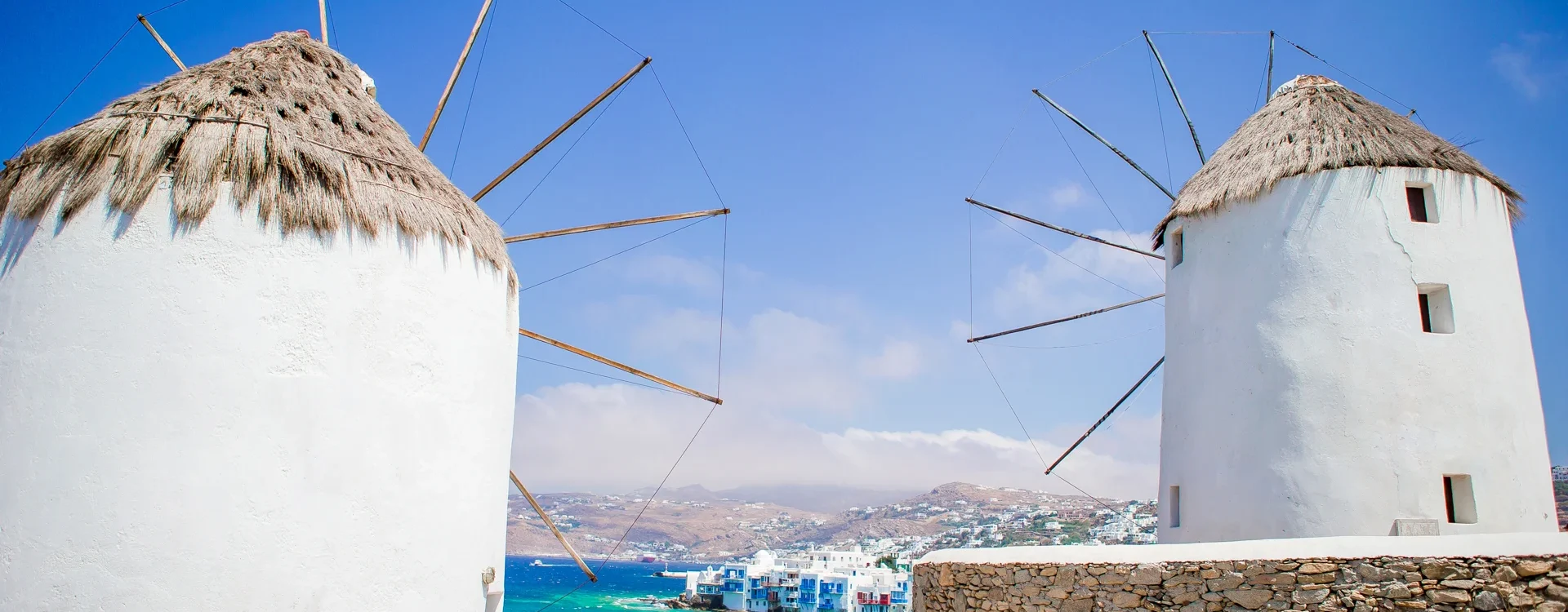 old-traditional-windmills-over-the-town-of-mykonos-2025-02-11-16-33-28-utc