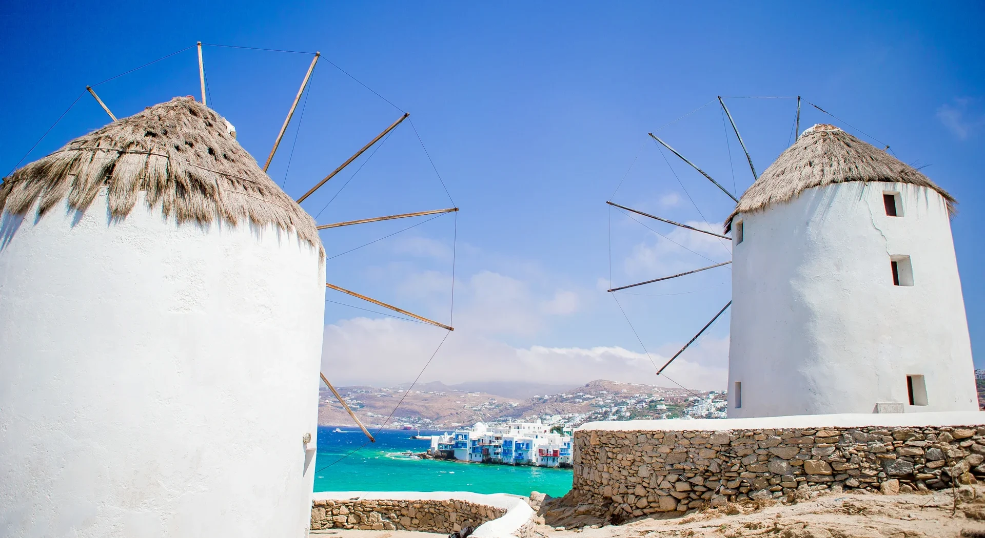 old-traditional-windmills-over-the-town-of-mykonos-2025-02-11-16-33-28-utc