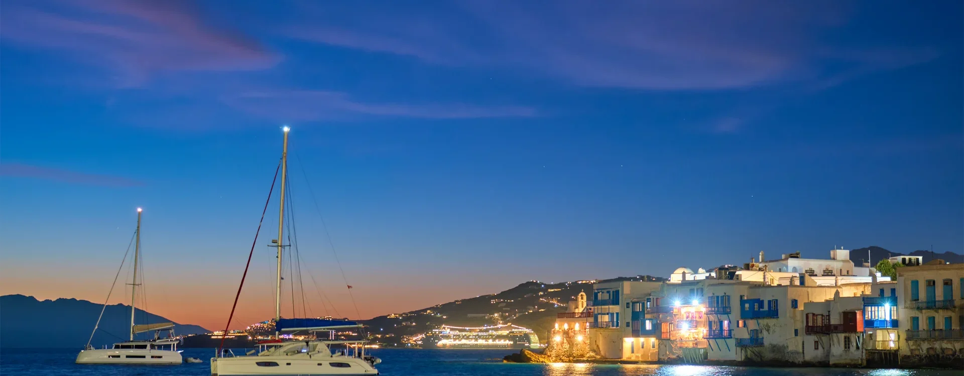 sunset-in-mykonos-greece-with-cruise-ship-and-ya-2024-10-18-05-31-25-utc