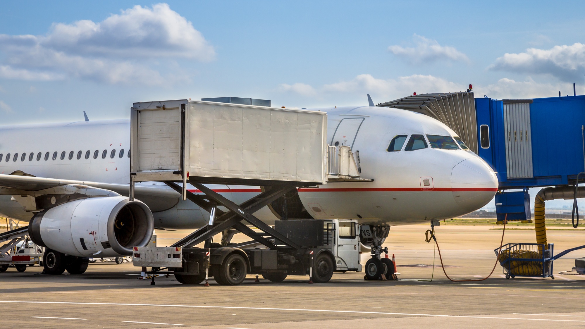 Passenger jet airplane docked on airport gate